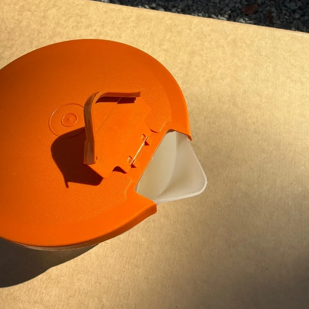 Vintage Tupperware Orange Lidded Measuring Cup